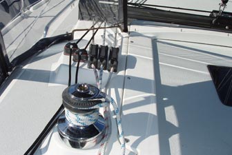 On the Catalina 309, the jib and spinnaker halyards, and line for the boom vang, all lead through stoppers to a self-tailing winch