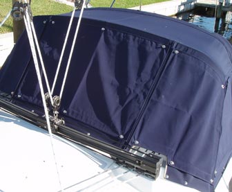 Snap-on canvas covers protect the isinglass on the Catalina 309