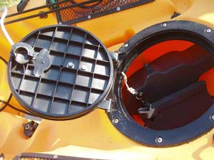 The cleat is attached to the hatch lid with stainless machine screws and locking nuts, with a couple of washers to help distribute the load. 
