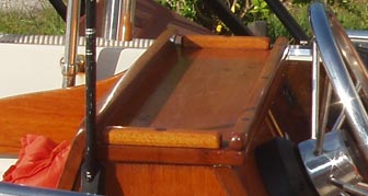 Wood rails around the perimiter of the steering console