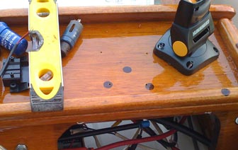 I drilled 4 holes in the console for the mounting base screws.