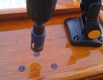 Preparing to drill a one-inch hole in the to of my mahogany Whaler console