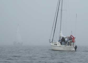 Sailboats fog