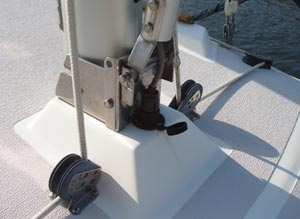 This picture shows how the MacGregor mast raising device is attached to the tabernacle mast base of the Precision 23. The plates used are actually a small boat hinged mast step available from Dwyer, and they happen to fit perfectly on the Precision 23 mast step, also from Dwyer Masts. One hole through the mast step on the 23 was all that was required to attach the unit.