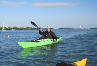 Guy In A Green Kayak